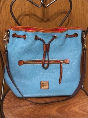 Dooney & Bourke Light Blue Pebbled Leather Drawstring handbag with Brown Trim